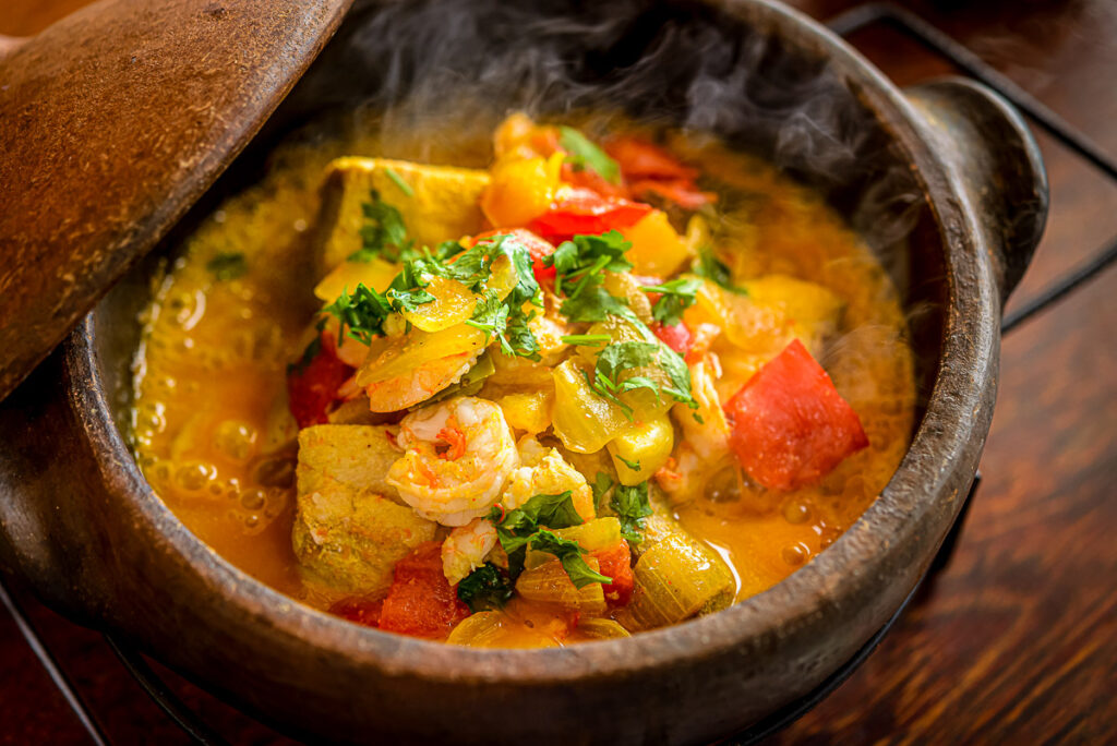 Boiled, Bowl - Dishware, Brazilian Culture, Calor, Coconut milk, Condiment - Seasonings, Cultures, Dishware, Fish, Fruits Gourmet, Healthy Eating, Meals, Pepper - Vegetable, Ready-to-eat, Rustic, Sophisticated Dinner, Soup, Spices, background, bahia, bowl, brazil, clay, clay pots, cooked, cooking, cuisine, dinner, dish, food, gastronomy, horizontal, lunch, northeast, red, restaurant, sea, seafood, table, table setting, vegetable